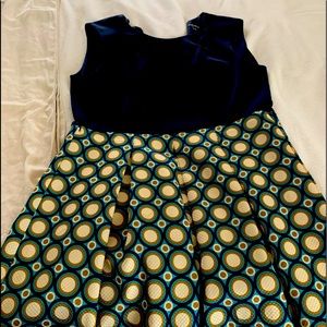 Sleeveless blue dress with multicolor skirt